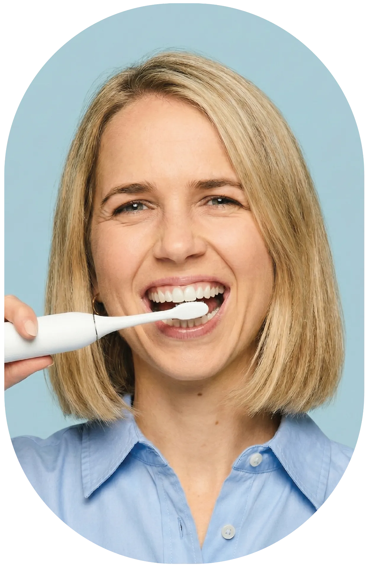 Happy patient brushing teeth